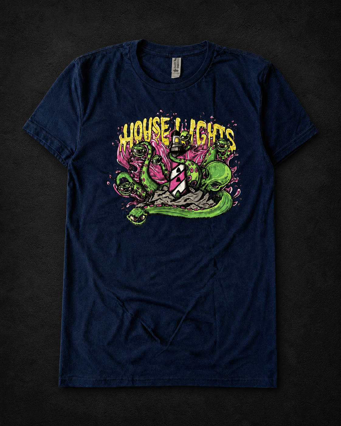 Navy Kraken T-Shirt laid flat on a textured black background